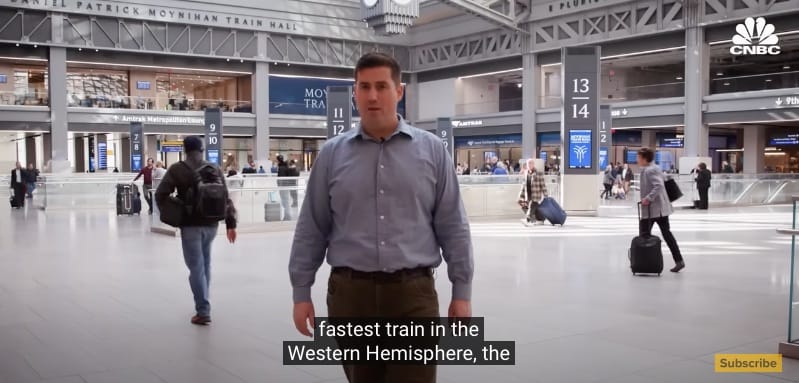 Journalist talking in a train station