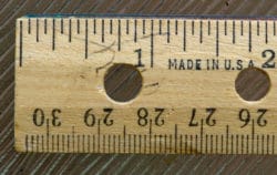 A wooden ruler, made in US with both cm and inches